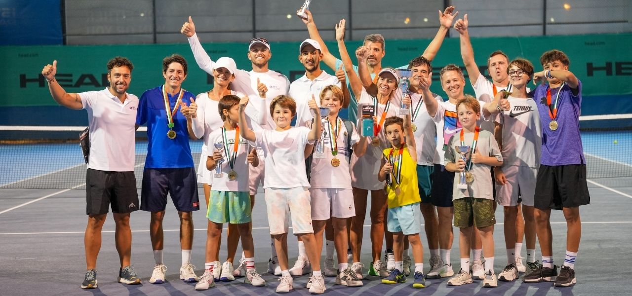 A group of kids after a tennis tournament at ISD ProStyle tennis academy in dubai sports city