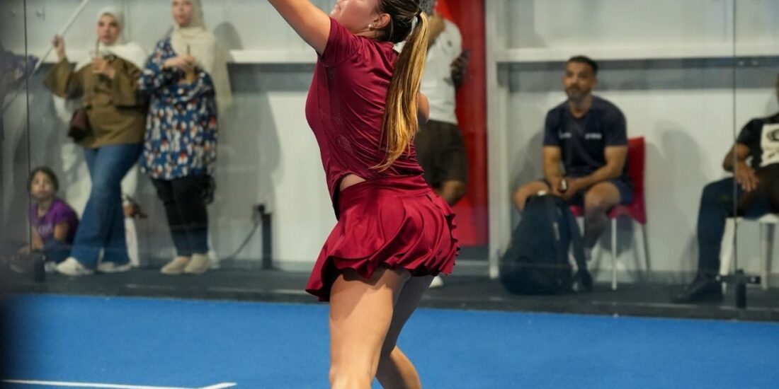 Padel coach Angelina N (Coach Angy) playing padel in one of ISD Padel's padel courts in dubai