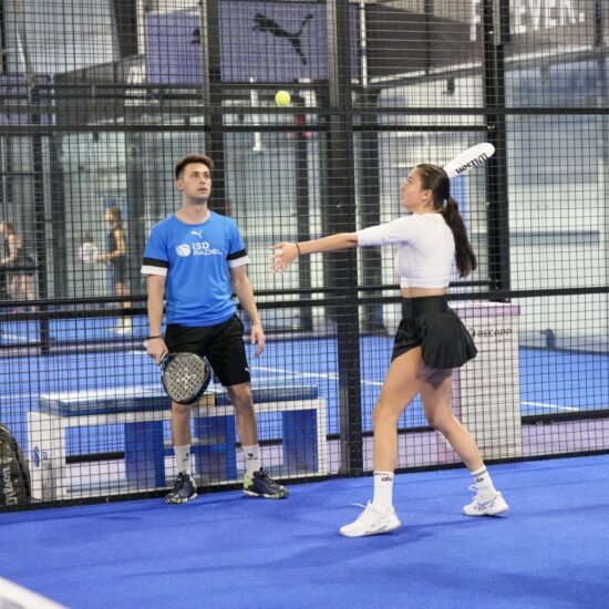 Padel coach Dani Moreno giving padel lessons in Dubai psorts city for client who has chosen private padel coaching classes at ISD Padel