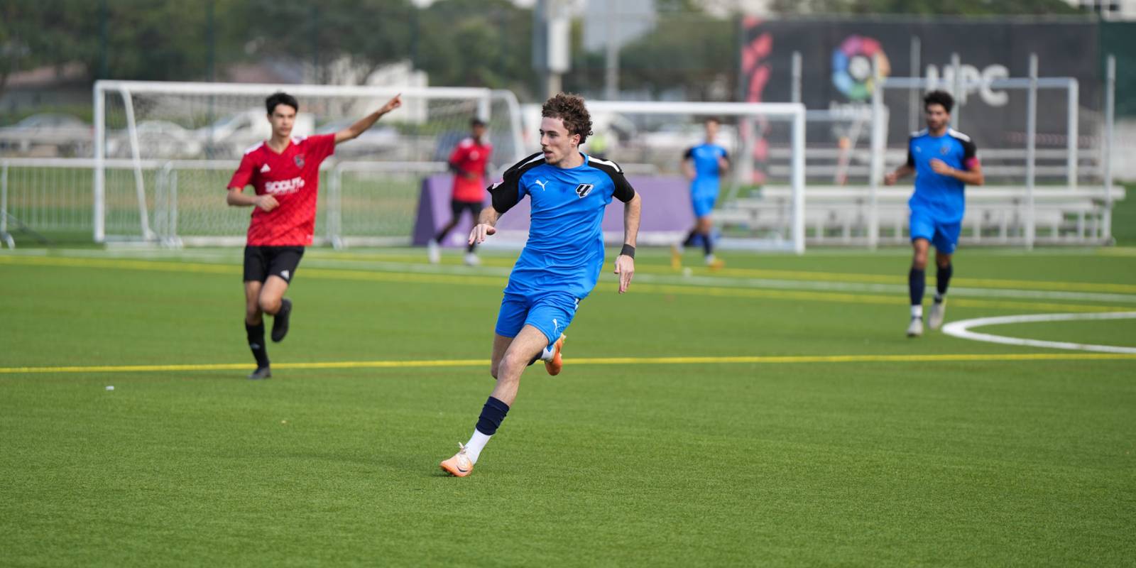 Boy playing a competitive match for LaLiga Academy Dubai