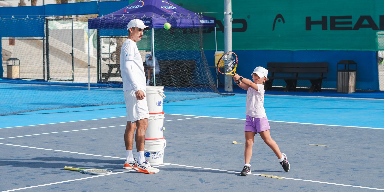 A young girl learning Tennis on the first day of the new season at ISD ProStyle Tennis in Dubai Sports City