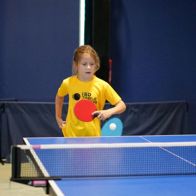 A young girl learning to play Table Tennis at ISD Table Tennis Academy Dubai in Dubai Sports City