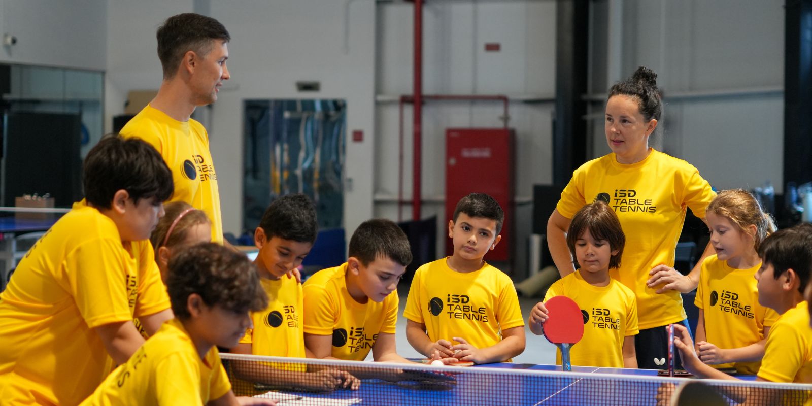 Table Tennis coaches Alexey Liventsov & Yulia Prokhorova with their students at ISD Table Tennis