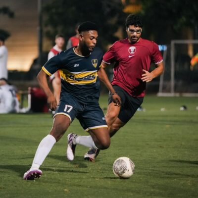 A corporate football player of the GymNation Corporate football team playing during a match in the Dubai Corporate Football League held at ISD Dubai Sports City in Dubai Sports City