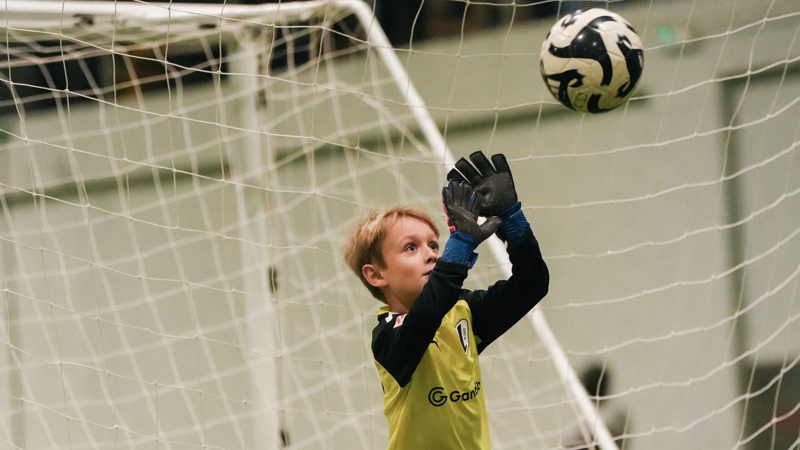 A goal keeper from LaLiga Academy Dubai's U14 Advanced Squad blocking a shot at goal during a match in DOFA League 2024 2025