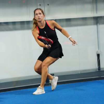 A lady in the middle of a Padel match at ISD Padel in Dubai Sports City (3)