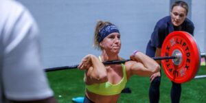 A woman lifting weights at the precision pairs competition held at ISD Dubai Sports City