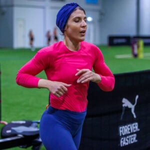 A woman running during an event at Precision pairs that was held at ISD Dubai Sports City