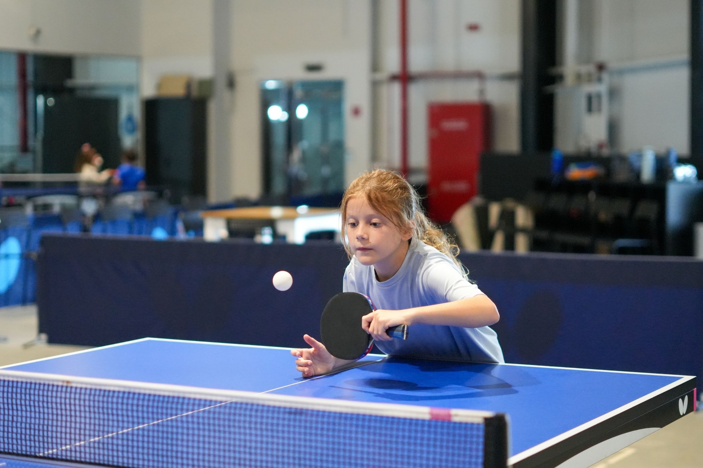 A young girl practicing Table Tennis at ISD Table Tennis in Dubai Sports City