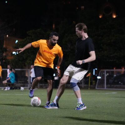 An DHL employee taking part in the Dubai Corporate Football League at ISD Dubai Sports City