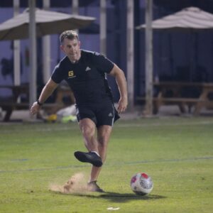 An employee of GymNation taking part in the Dubai Corporate Football League at ISD Dubai Sports City