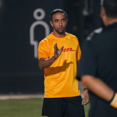 DHL's corporate football team mentor dishing out strategy during the half-time of a match in the Dubai Corporate Football League organized by ISD Football at ISD Dubai Sports City