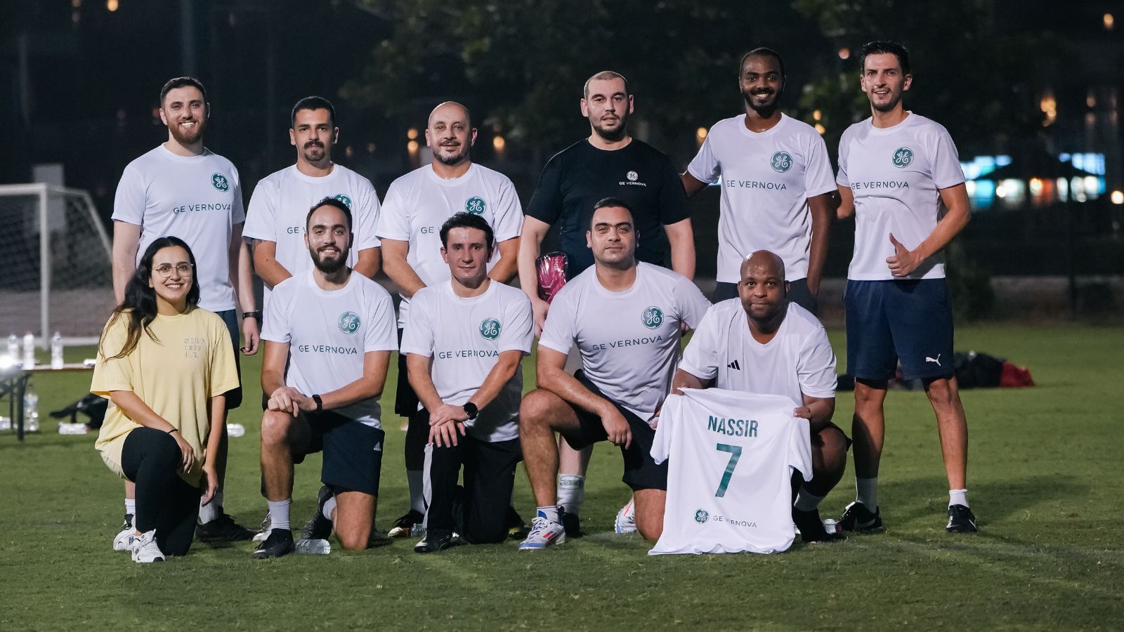 The corporate football team of GE Vernova posing for a team picture before their match in the Dubai Corporate Football League