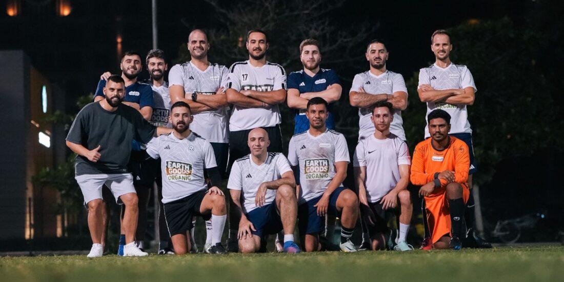 The corporate football team of Transmed posing for a team picture before their match in the Dubai Corporate Football League