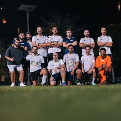 Transmed's Corporate football team posing for a team photograph before a match in the Dubai Corporate Football League held at ISD Dubai Sports City in Dubai Sports City